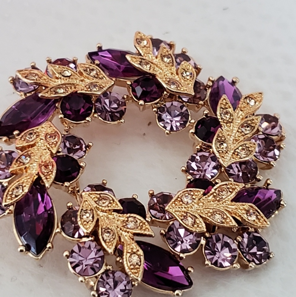 Beautiful brooch with purple rhinestones